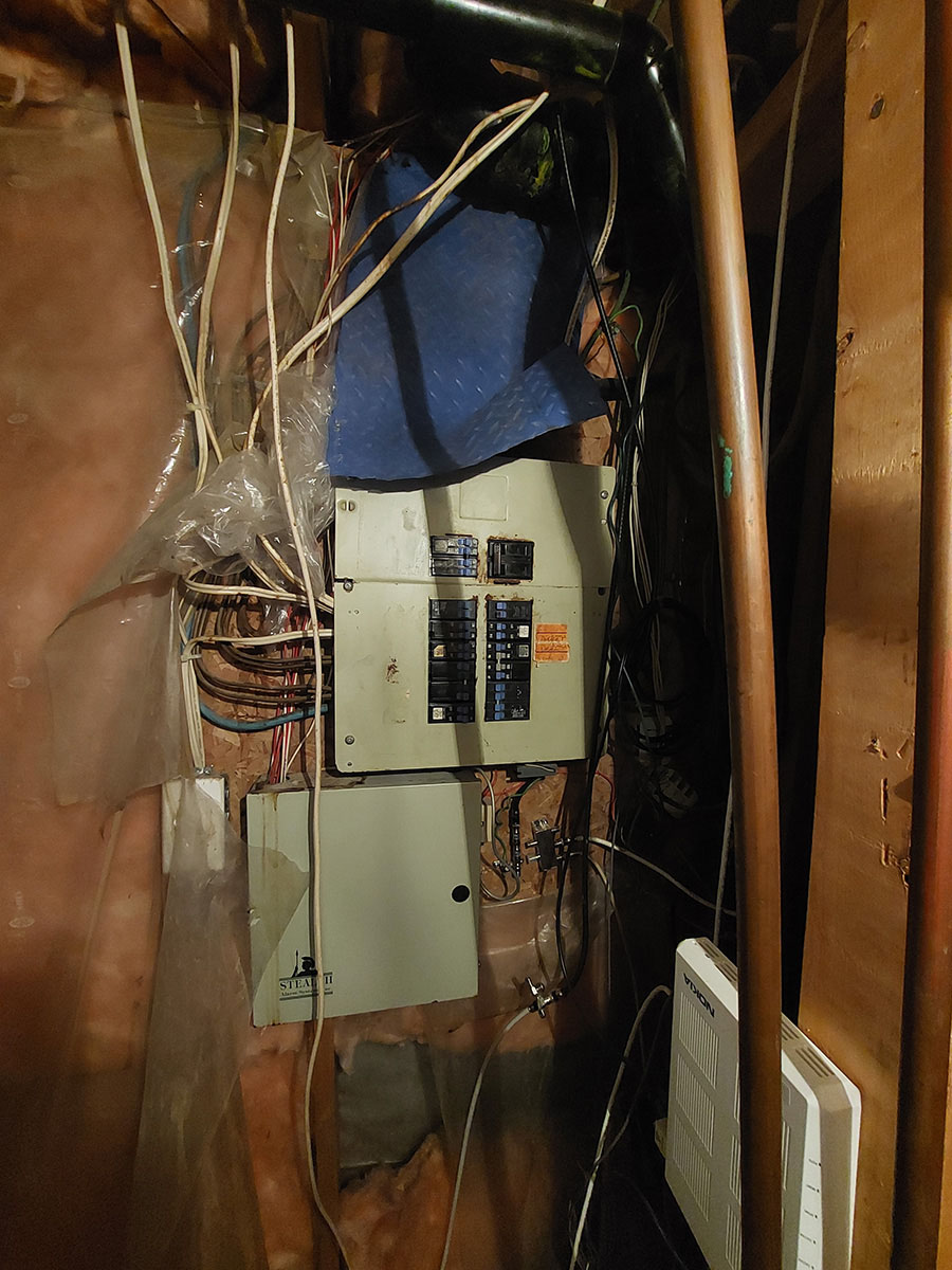 buying a home in Calgary home inspection June 23, 2023 crazy electrical fix for leak over electrical panel